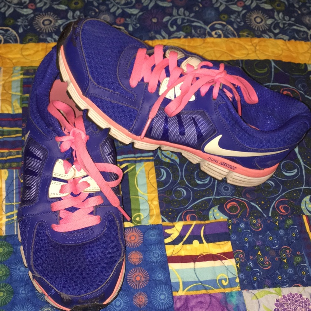 Vibrant pink and blue Nike tennis shoes